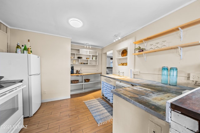 kitchen featuring white appliances, light wood-type flooring, open shelves, and ornamental molding