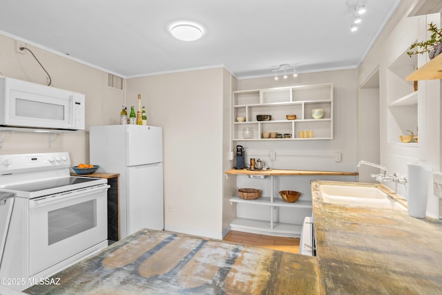 kitchen featuring visible vents, a sink, ornamental molding, white appliances, and open shelves