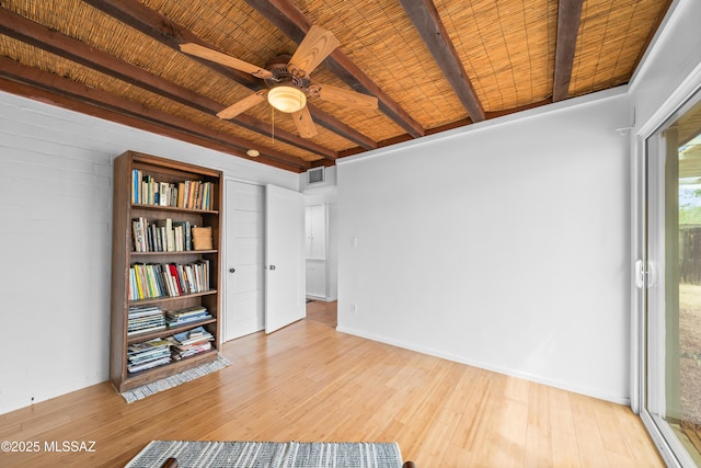 interior space featuring visible vents, beam ceiling, wooden ceiling, wood finished floors, and a ceiling fan