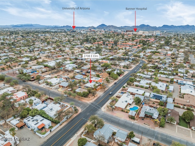 drone / aerial view featuring a residential view and a mountain view