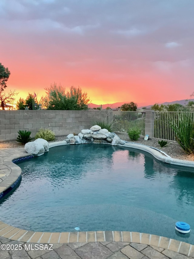 13827 E Fiery Dawn Dr, Vail, AZ 85641 - pool at dusk with a fenced backyard