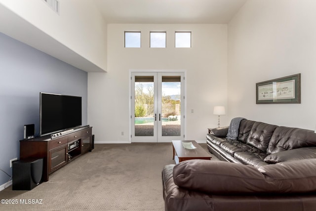 13827 E Fiery Dawn Dr, Vail, AZ 85641 - carpeted living room featuring a towering ceiling, french doors, visible vents, and baseboards