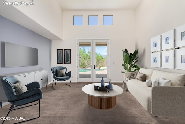 13827 E Fiery Dawn Dr, Vail, AZ 85641 - living area featuring french doors, a towering ceiling, and carpet