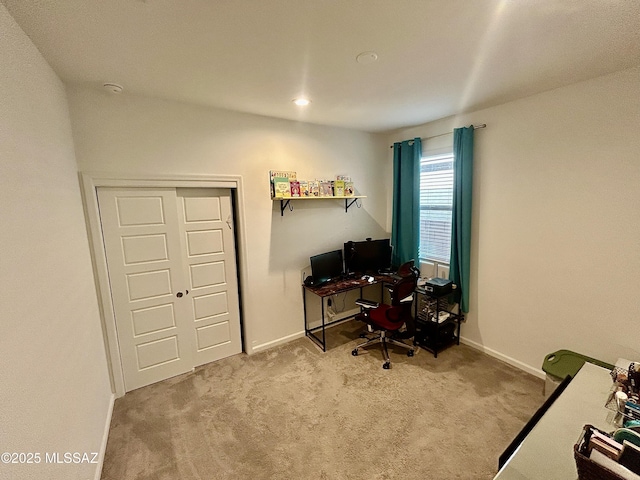 office area featuring baseboards and carpet floors