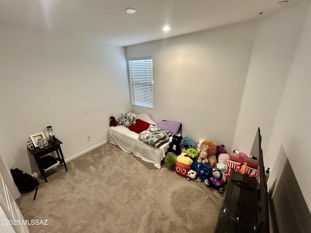 bedroom with baseboards and carpet