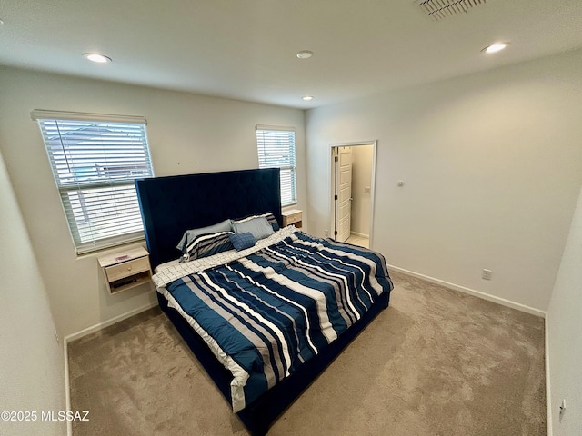 carpeted bedroom featuring recessed lighting, baseboards, and visible vents