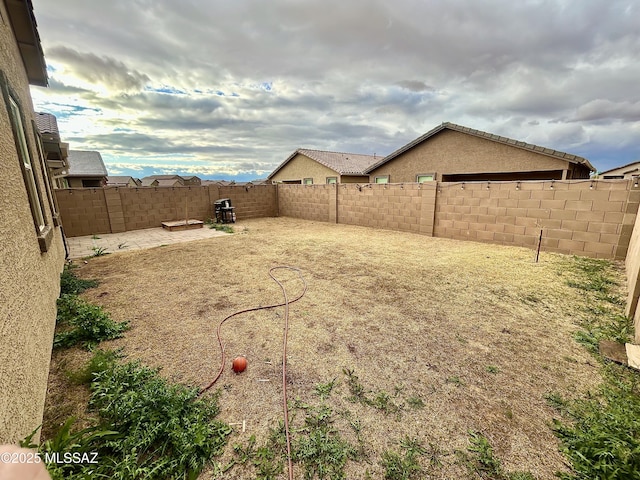 view of yard with a fenced backyard