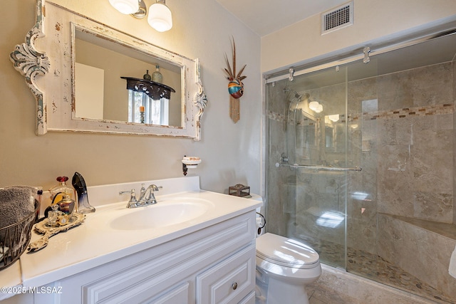 full bathroom featuring visible vents, a shower stall, toilet, and vanity