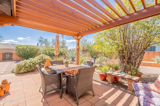 view of patio / terrace with outdoor dining space, a pergola, and a fenced backyard