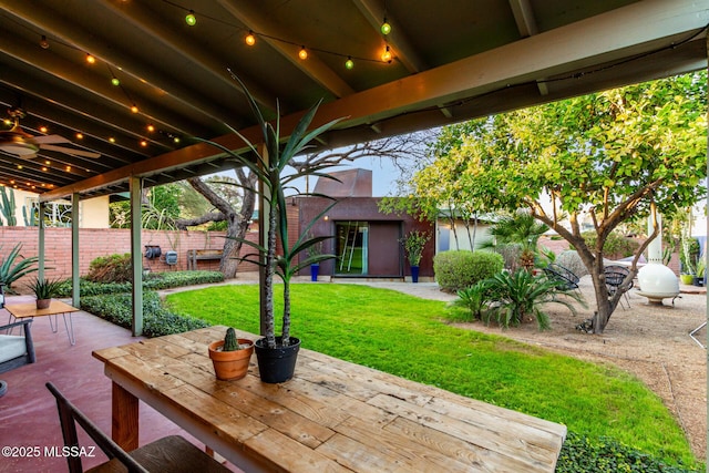 view of patio / terrace featuring fence