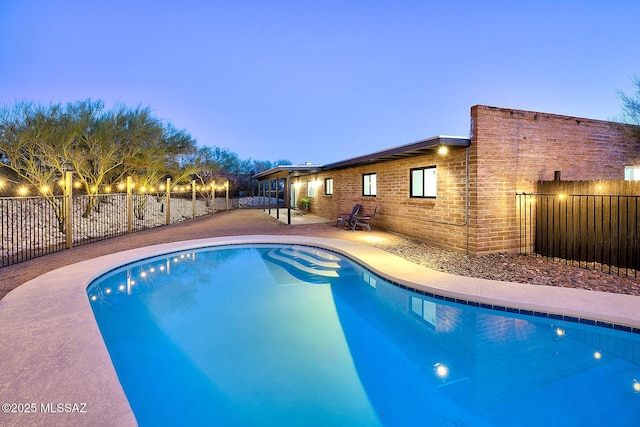 view of pool featuring a fenced in pool, a patio, and fence private yard