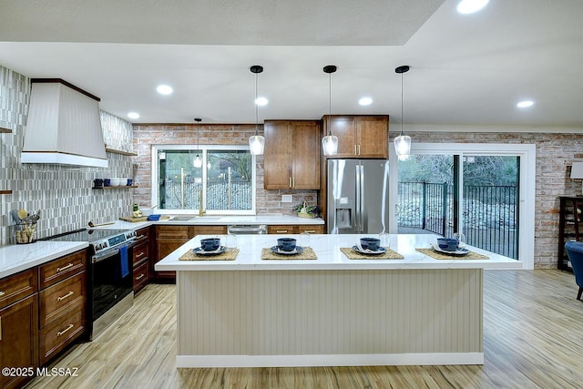 4040 N Camino Cardenal, Tucson, AZ 85718 - living area featuring brick wall, baseboards, and wood finished floors