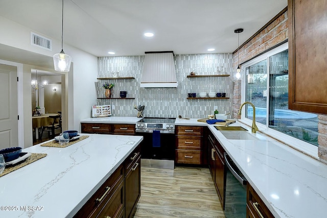 kitchen with visible vents, open shelves, premium range hood, stainless steel electric range oven, and a sink