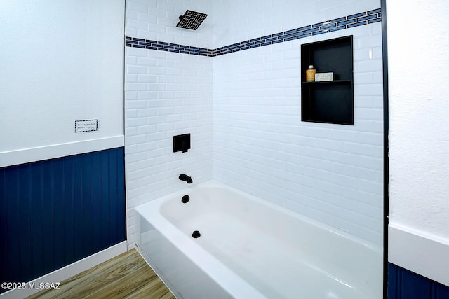 4040 N Camino Cardenal, Tucson, AZ 85718 - bathroom featuring wood finished floors, visible vents, a wainscoted wall, and a sink