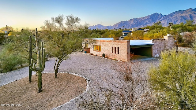 view of front of home with a mountain view