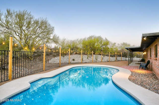 view of pool featuring a patio area, a fenced in pool, and a fenced backyard