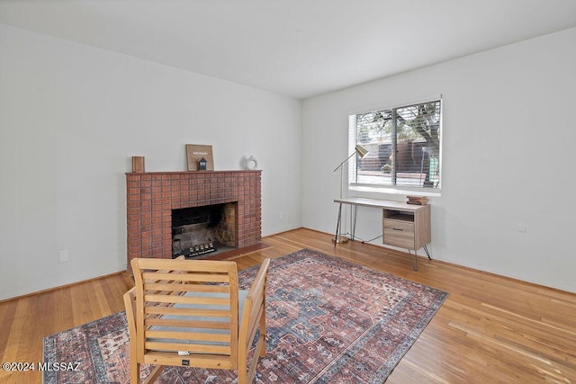 interior space with a fireplace and wood finished floors