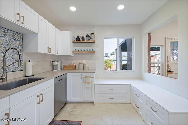 kitchen featuring white cabinets, dishwasher, recessed lighting, tasteful backsplash, and a sink