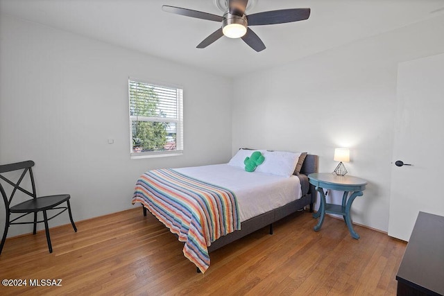 bedroom with ceiling fan and wood finished floors