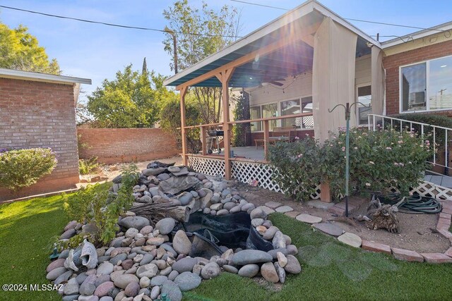 view of yard featuring a deck and fence
