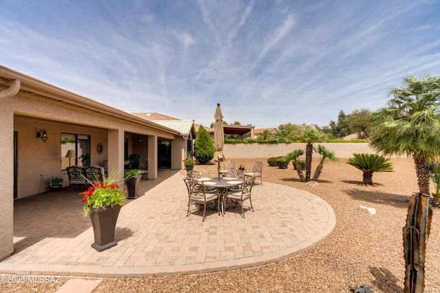 view of patio / terrace featuring outdoor dining area and fence