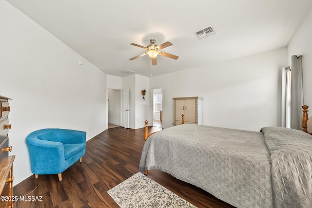 bedroom with wood finished floors, visible vents, and ceiling fan