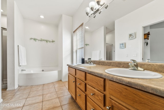 bathroom with a sink, a bath, a shower stall, and tile patterned flooring