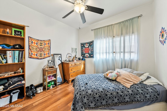 bedroom featuring ceiling fan and wood finished floors