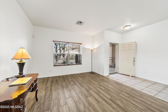 interior space with visible vents and light wood-style flooring