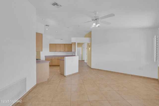 kitchen featuring light tile patterned flooring, visible vents, baseboards, and a ceiling fan