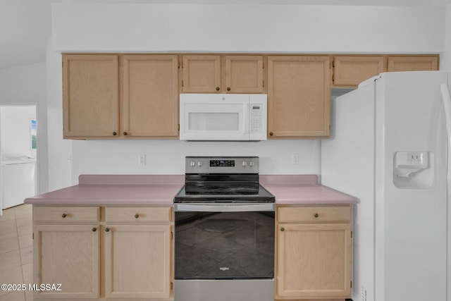 kitchen featuring white appliances, light brown cabinets, and light countertops