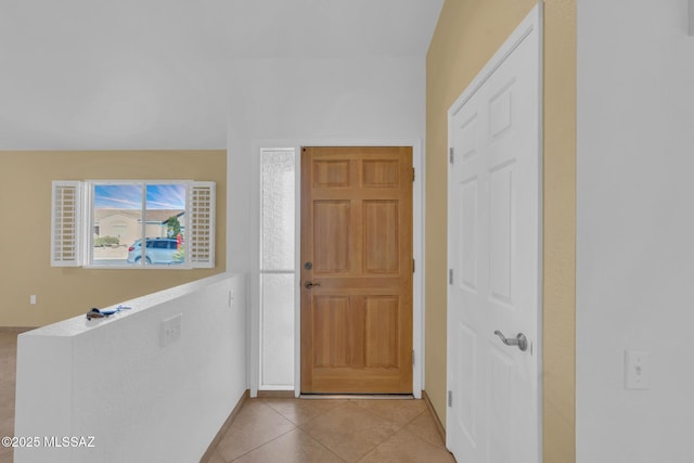 foyer with light tile patterned floors