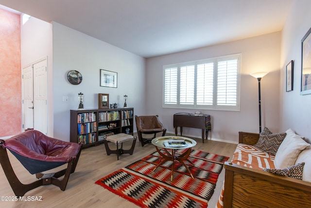 4920 W Harris Hawk Pl, Tucson, AZ 85745 - living room with light wood-style floors and baseboards