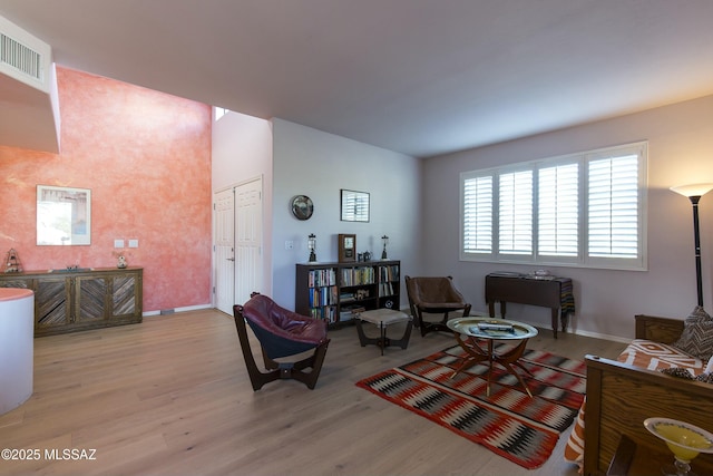 4920 W Harris Hawk Pl, Tucson, AZ 85745 - living area with light wood-style flooring and baseboards