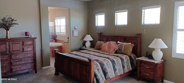 16311 S Creosote View Ln, Vail, AZ 85641 - bedroom featuring light colored carpet, ensuite bath, and baseboards