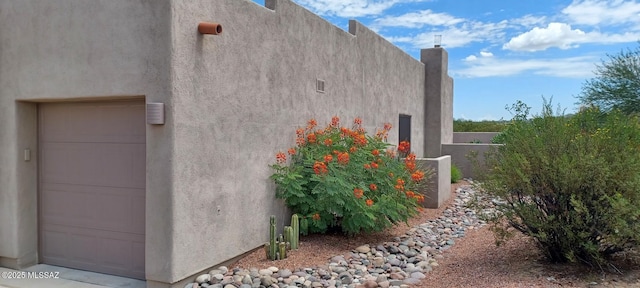 16311 S Creosote View Ln, Vail, AZ 85641 - view of property exterior with stucco siding and a chimney