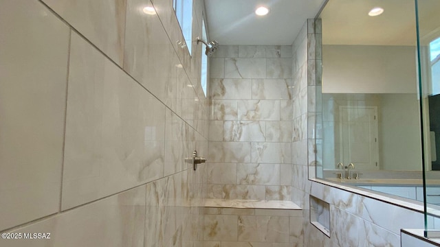 full bath with recessed lighting and a tile shower