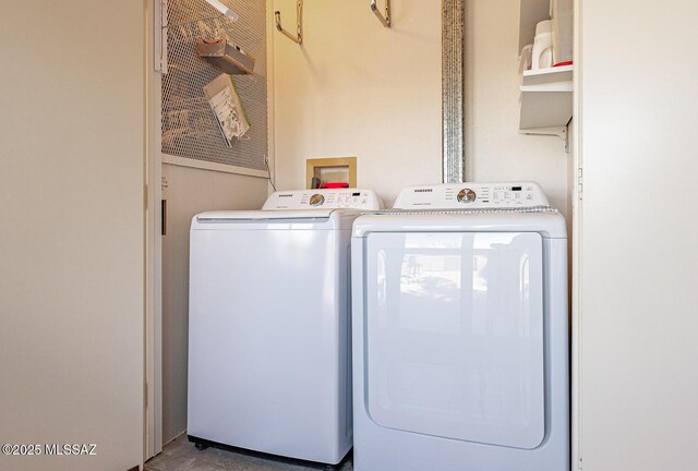 laundry area featuring laundry area and washer and clothes dryer