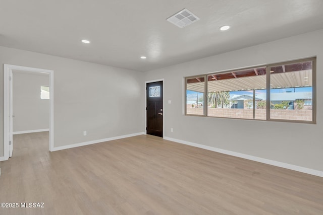 unfurnished room with recessed lighting, visible vents, baseboards, and light wood finished floors