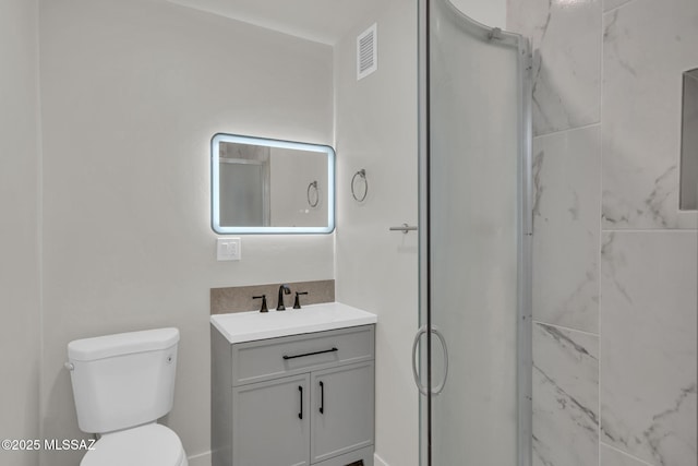 full bath featuring visible vents, vanity, toilet, and a shower stall