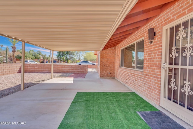 view of patio / terrace featuring fence