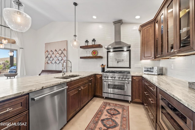 kitchen with a sink, tasteful backsplash, stainless steel appliances, wall chimney exhaust hood, and light stone countertops