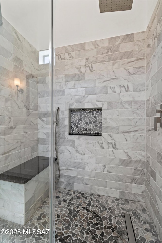 bathroom featuring a shower stall