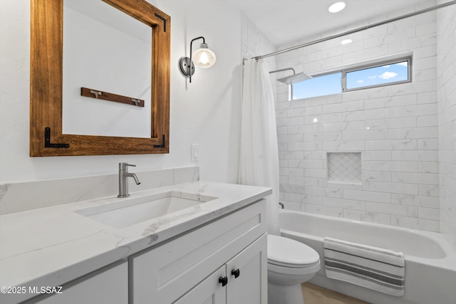 full bath featuring vanity, toilet, and shower / bathtub combination with curtain