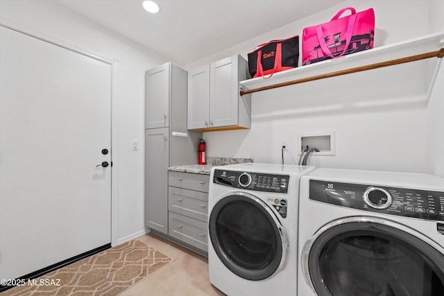 laundry area featuring washer and clothes dryer, recessed lighting, and cabinet space