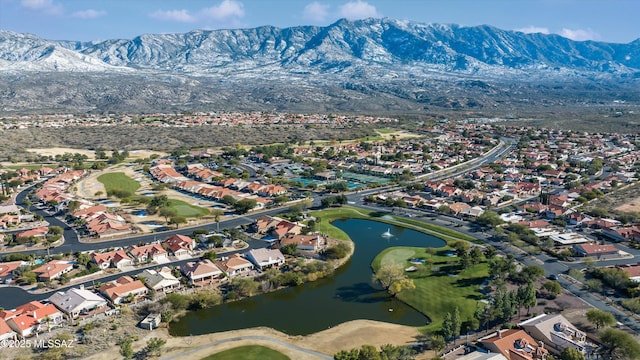 drone / aerial view featuring a residential view and a water and mountain view