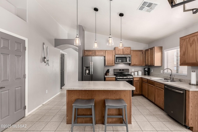 kitchen featuring visible vents, a sink, stainless steel appliances, light countertops, and light tile patterned floors