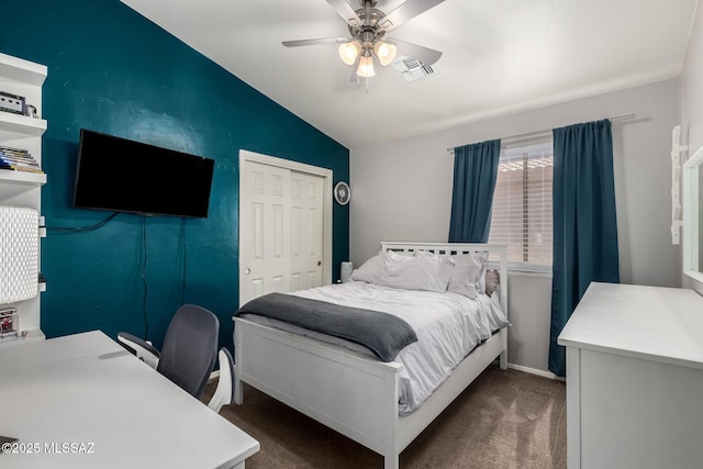 bedroom with visible vents, ceiling fan, vaulted ceiling, carpet flooring, and a closet