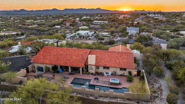 5420 N Suncrest Pl, Tucson, AZ 85718 - rear view of house with fence, a mountain view, a tiled roof, and stucco siding