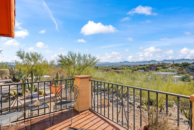 balcony featuring a mountain view